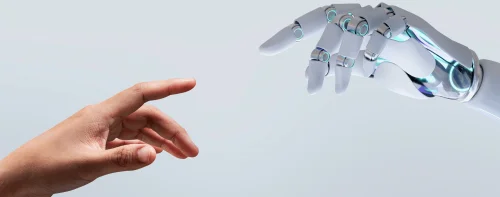 Bàn tay người và bàn tay robot hướng về nhau